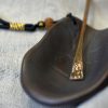 Tortoiseshell-shaped ceramic tea scoop with a copper handle